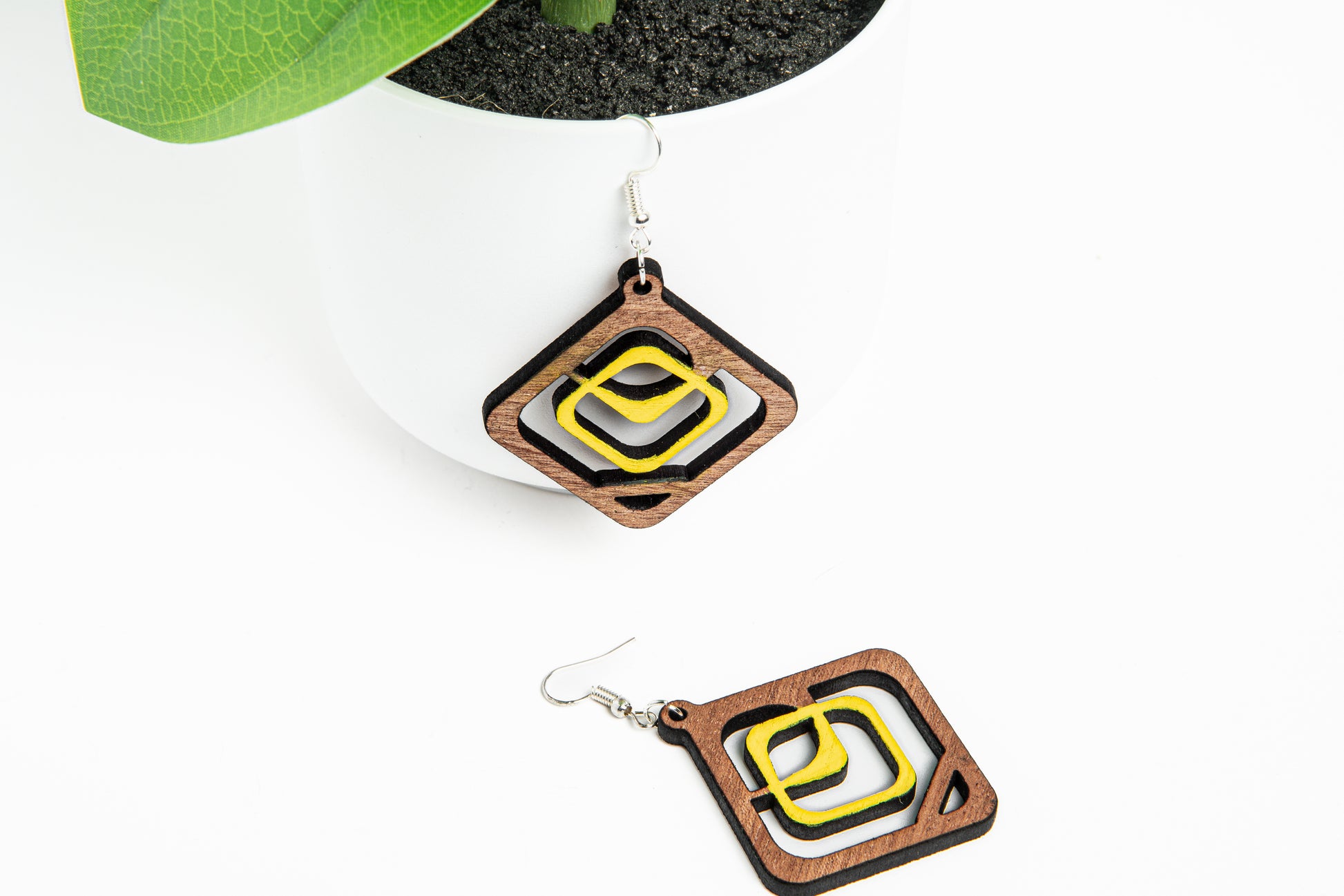 Indulge in the timeless allure of these squared wooden earrings meticulously handcrafted from high-quality wood